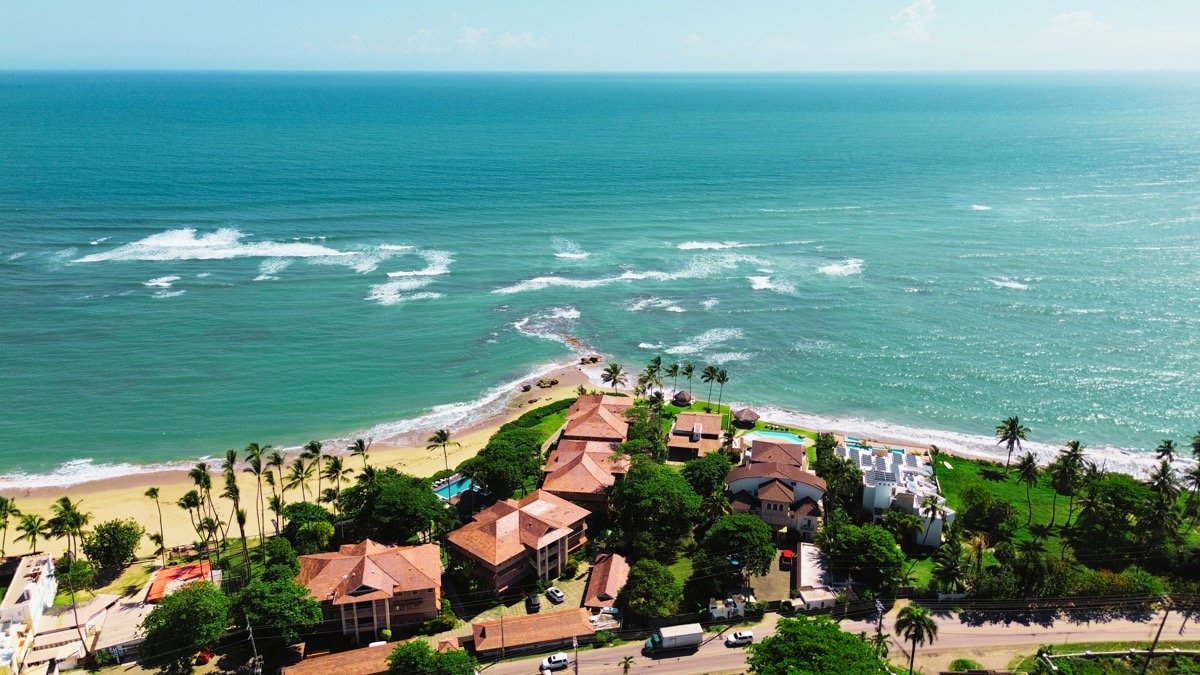 Drone aerial shot of Ocean Dream beachfront real estate Sosúa Dominican Republic — turquoise water and North Coast coastline